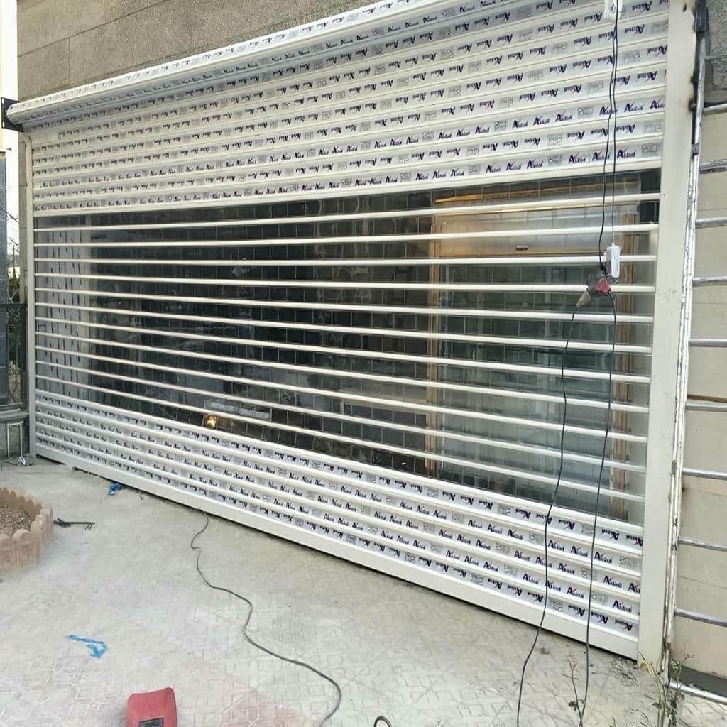نصب درب کرکره ای پارکینگ اتوماتیک با ریل تقویت‌شده