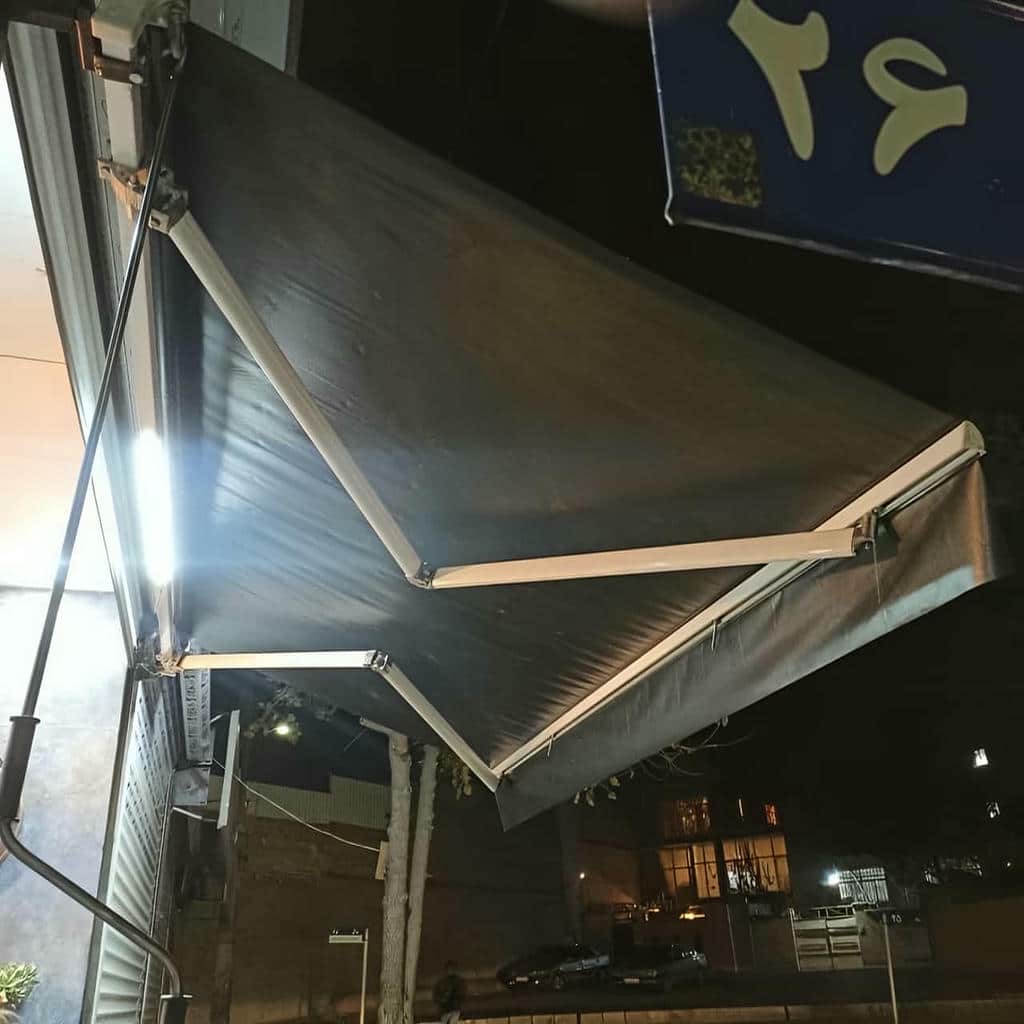 سایبان برقی بازویی در بوشهر با پارچه روشن مرکز عرضه و سفارش سایبان برقی در بوشهر و حومه